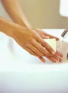 a close-up of a person washing hands
